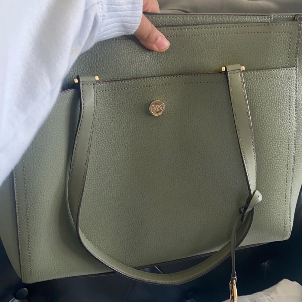 Michael kors used bag color green it has a few stains inside
